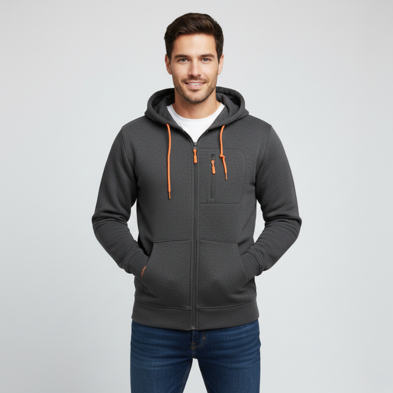 Man wearing a gray hoodie with orange zippers on a light gray background