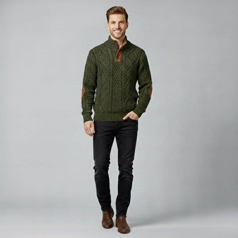 Man wearing a green sweater with brown accents on a gray background