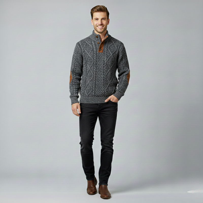 Man wearing a gray cable knit sweater with brown accents on a light gray background