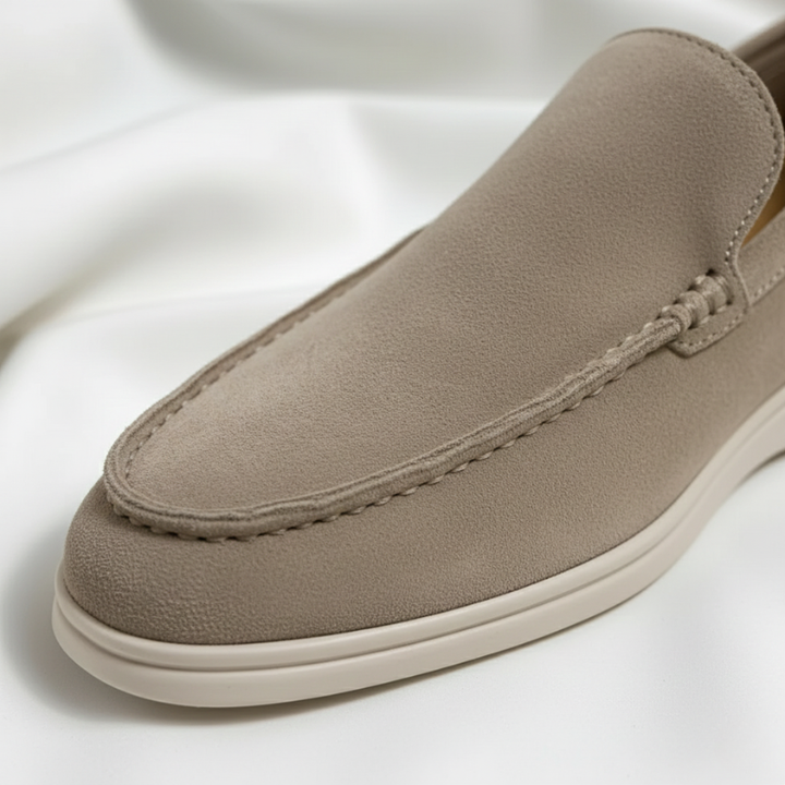 Beige loafer shoe on a white background