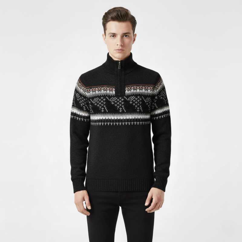 Man wearing a black sweater with a patterned design on a white background