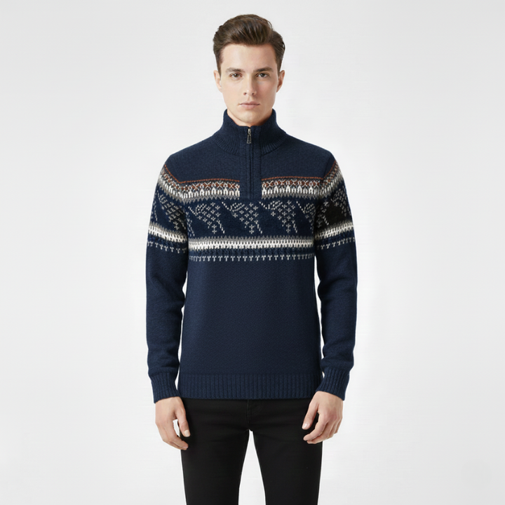 Man wearing a navy blue sweater with a patterned chest area on a white background