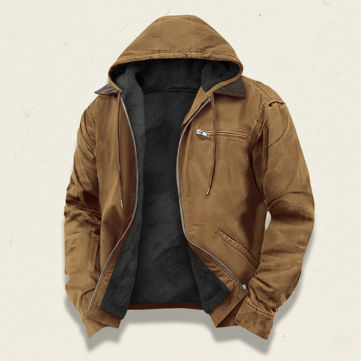 Flatlay image of a brown hooded jacket showcasing the front zipper, pockets, and overall rugged design.