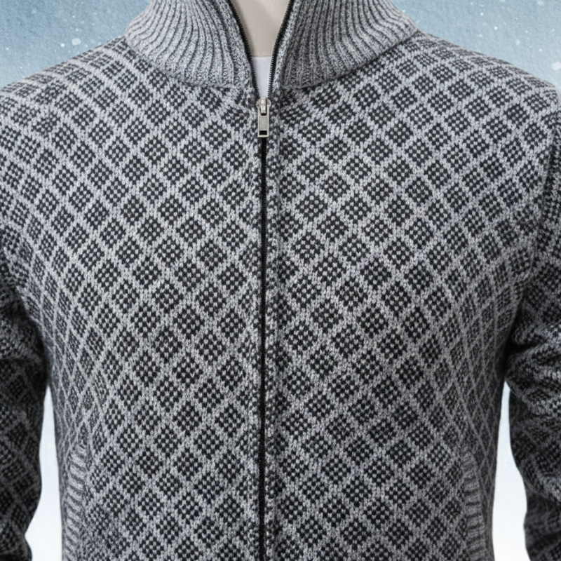 Close-up of a gray patterned cardigan showing textured knit design, zipper, and stitching details.