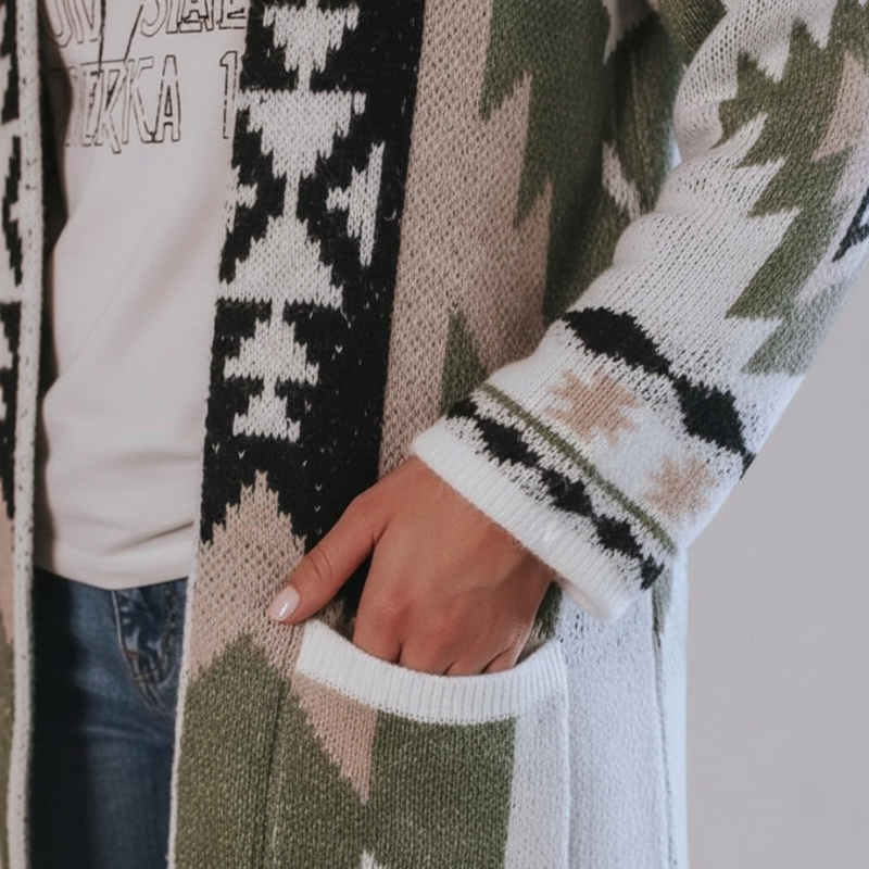 Close-up of the knit cardigan pocket showcasing the tribal pattern, stitching, and soft woven texture.
