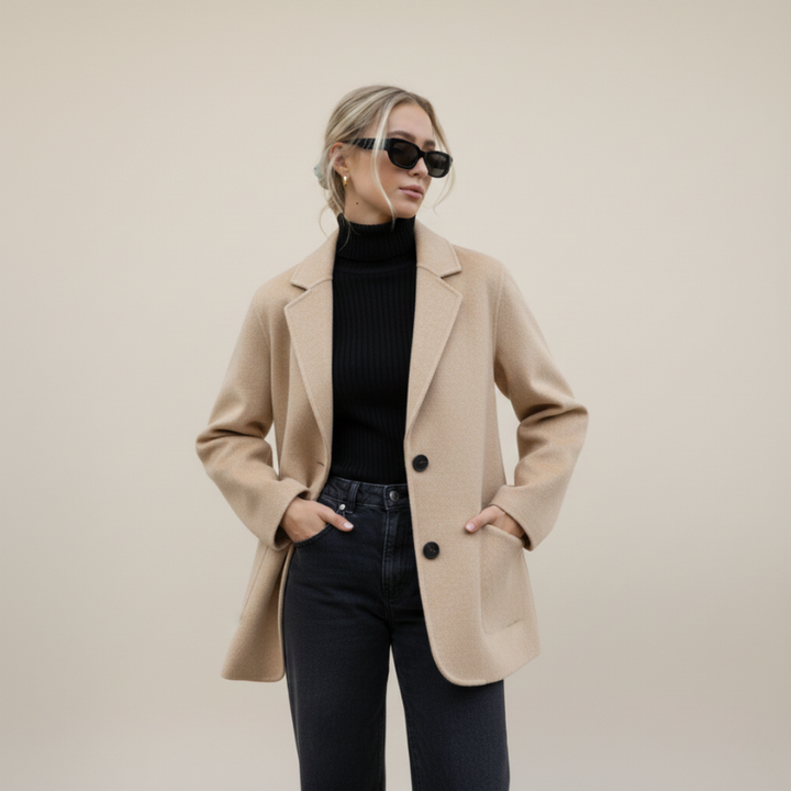 Women posing in beige blazer with handbag