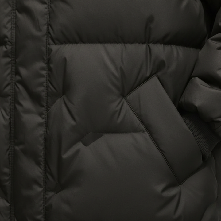 Close-up of a black puffer jacket with quilted texture