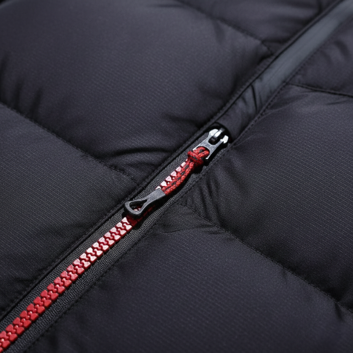 closeup view of winter parka zipper and stitching highlighting durable insulated fabric