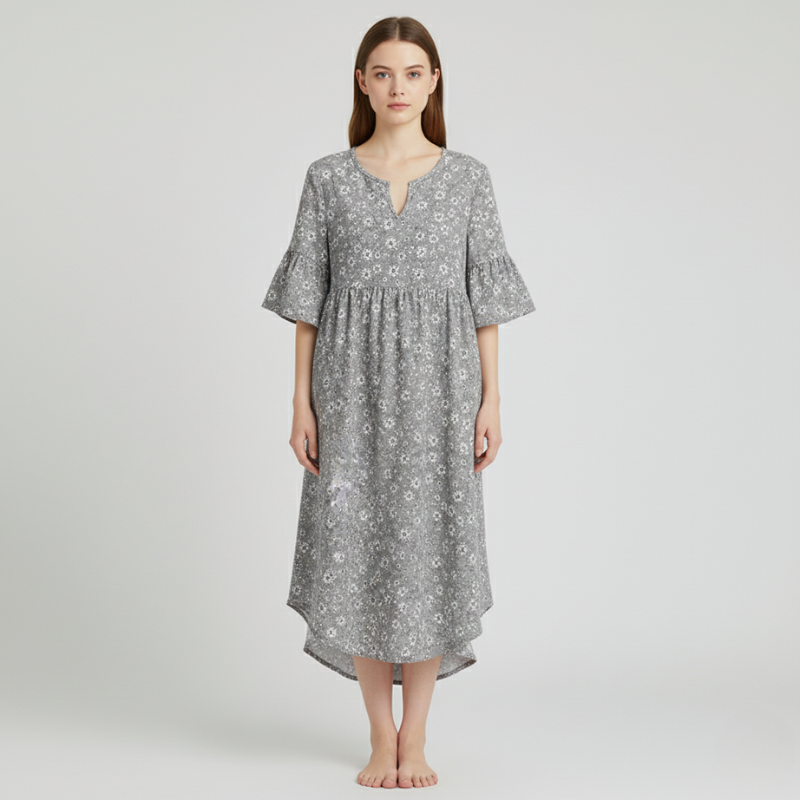 Woman wearing a gray floral dress on a white background