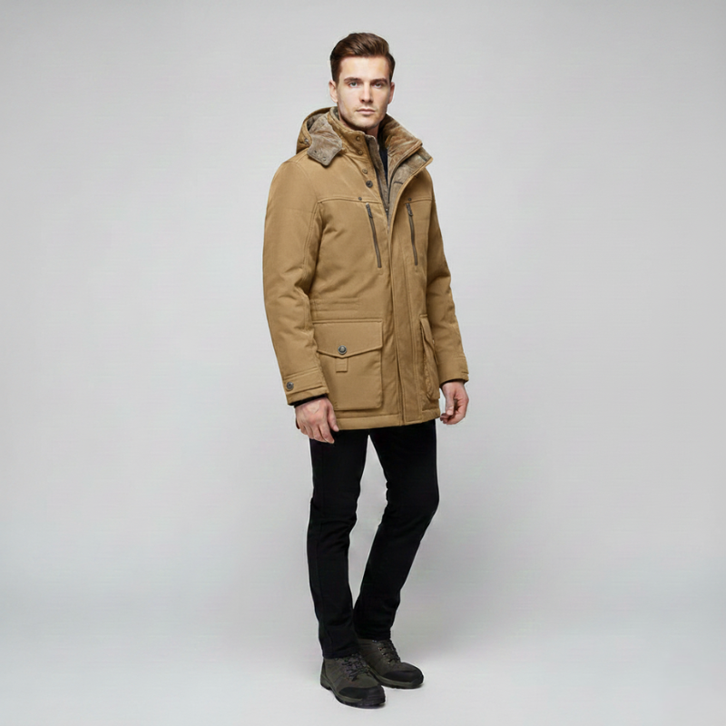 Male model wearing a beige hooded parka with zip and button closure designed for cold-weather layering.