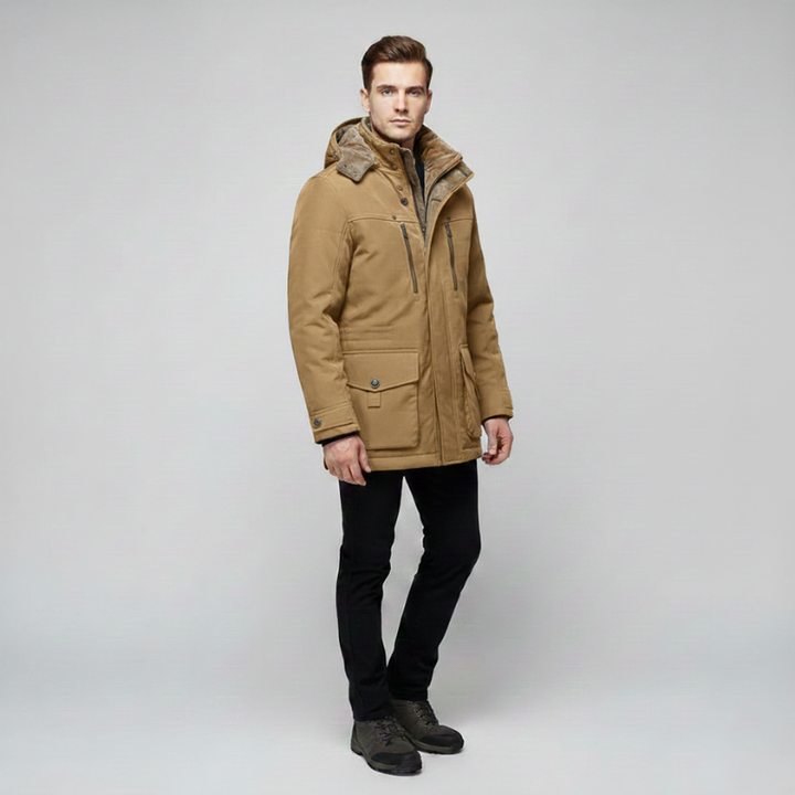 Male model wearing a beige hooded parka with zip and button closure designed for cold-weather layering.