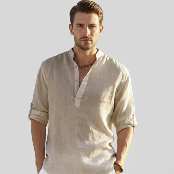 Male model wearing a beige linen button-down shirt showcasing a natural earthy summer tone.