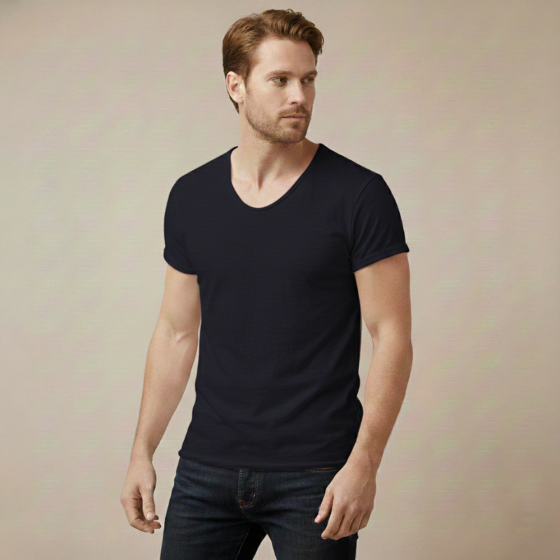 Man wearing a Blue V-neck T-shirt styled casually with a fitted silhouette in natural indoor lighting.