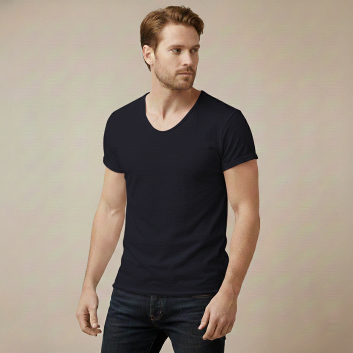 Man wearing a Blue V-neck T-shirt styled casually with a fitted silhouette in natural indoor lighting.