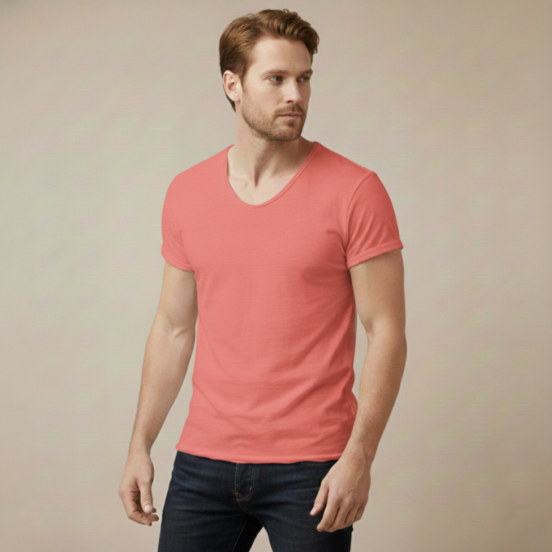 Model wearing a coral V-neck T-shirt featuring a slim fit and soft breathable fabric in a neutral studio.