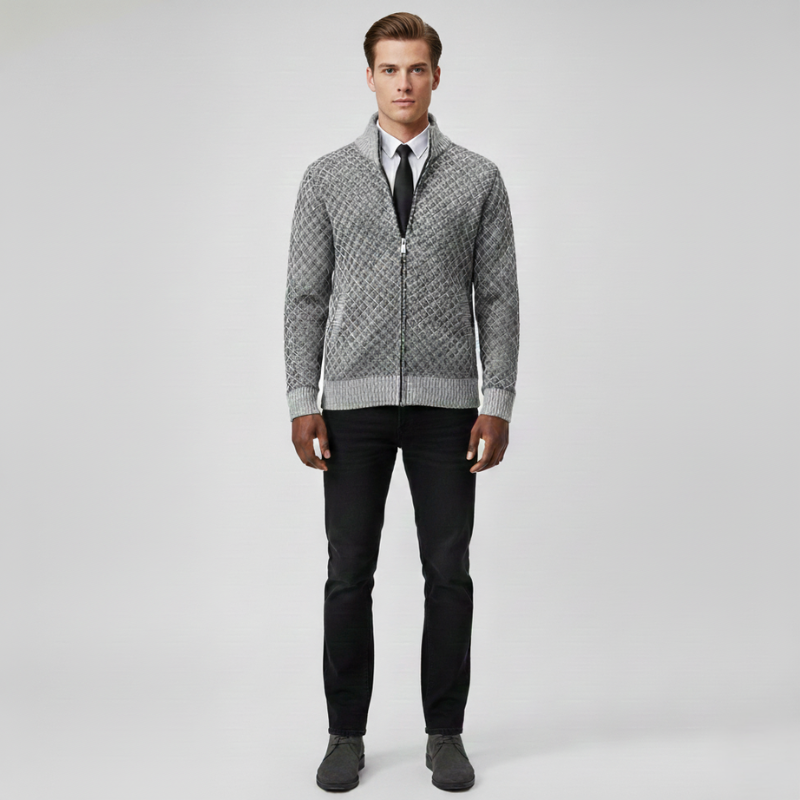 Male model wearing a light gray patterned zip cardigan with a clean tailored fit in soft studio lighting.
