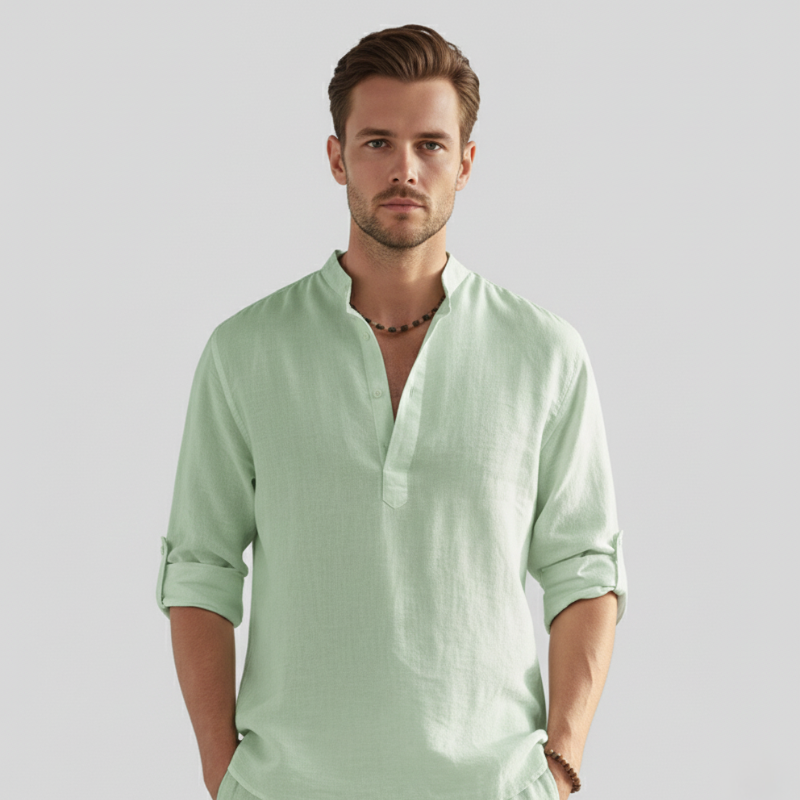 Model wearing a mint green linen long-sleeve shirt styled for fresh casual summer looks.