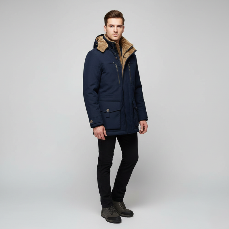 Male model wearing a navy blue hooded parka with a warm lining and zip-front closure in studio lighting.