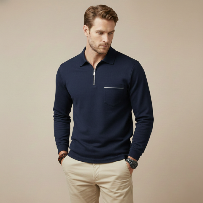 Male model in a navy long-sleeve quarter-zip polo shirt styled casually with beige pants.