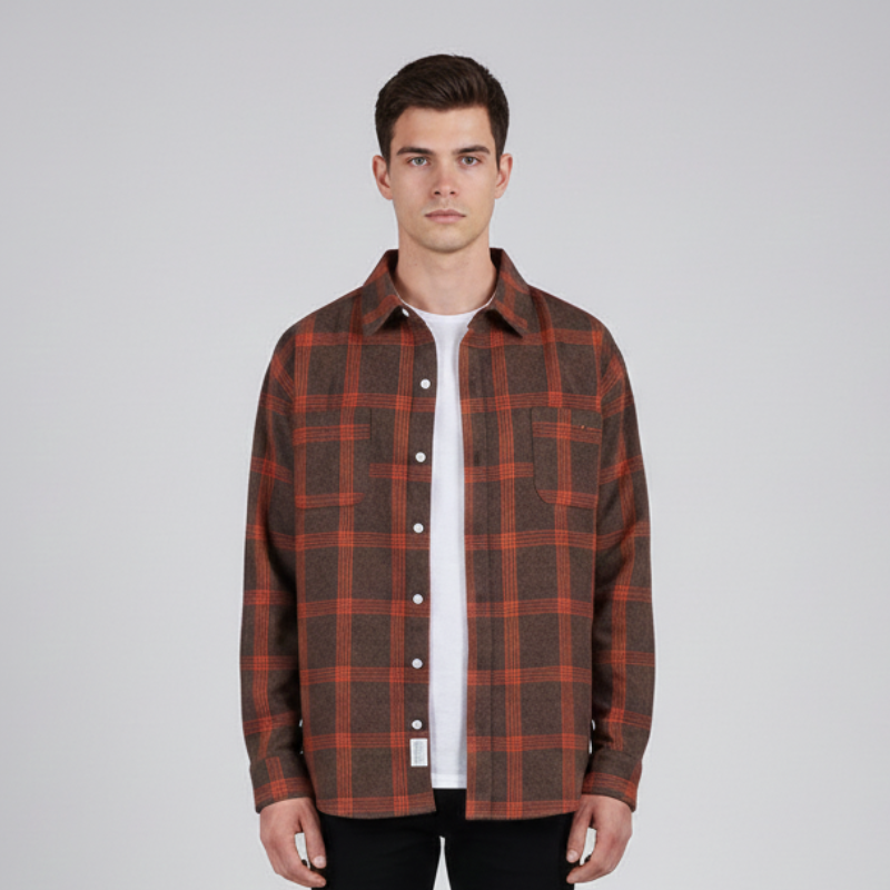 Male model wearing a red plaid button-up shirt styled casually for everyday fall or winter outfits.