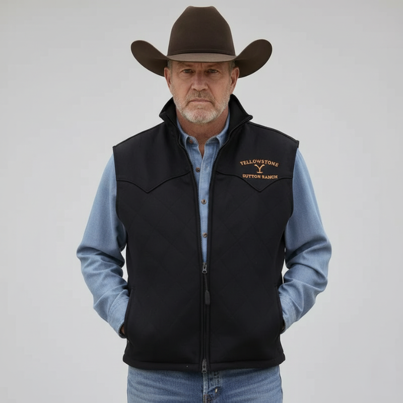 The model wears a black western vest with gold embroidery, a stand-up collar and a zipper over a denim shirt in the studio.