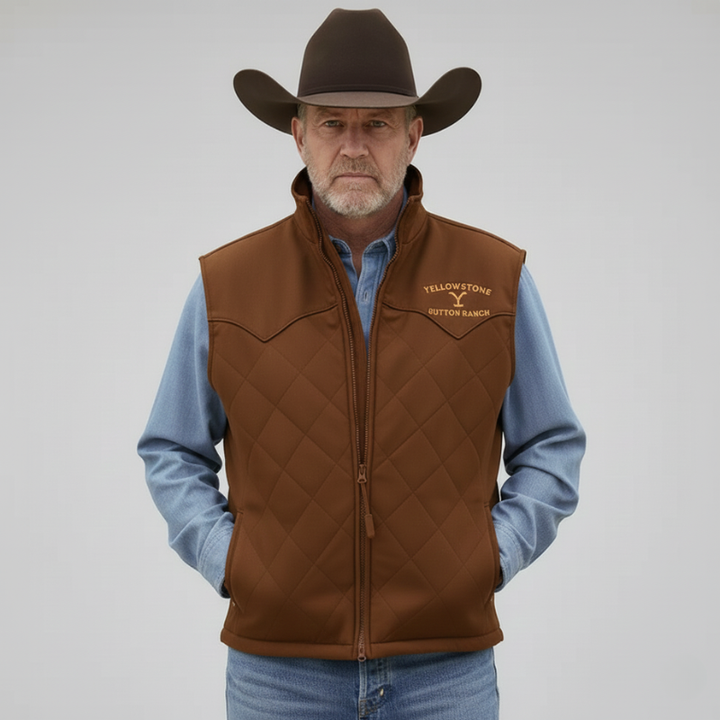 A brown western vest with gold chest embroidery and textured fabric is presented over a denim shirt in the studio.
