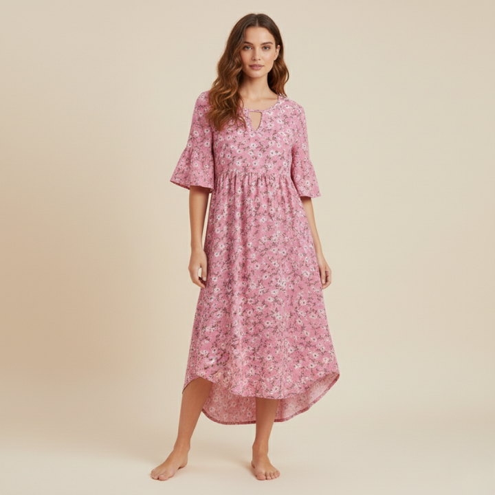 Woman wearing a pink floral dress on a beige background