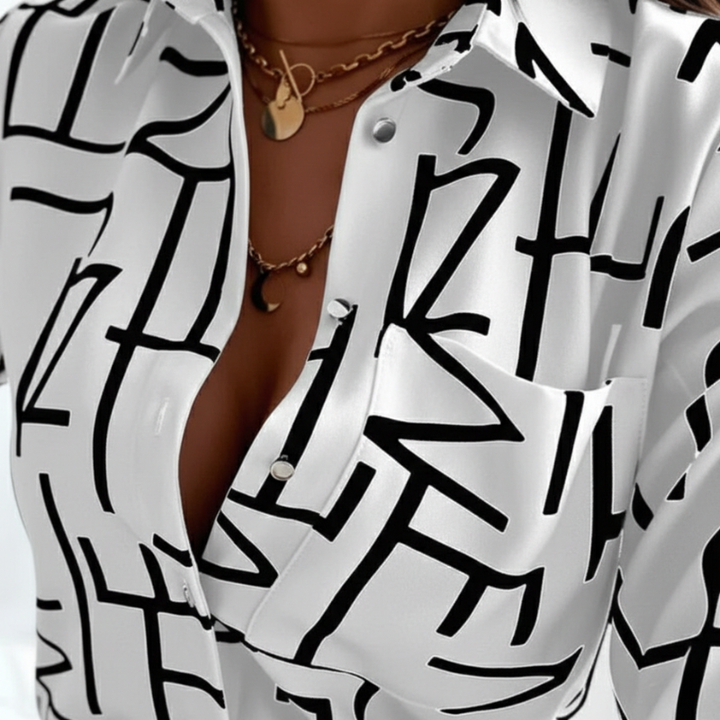 White shirt with black abstract pattern worn by a person