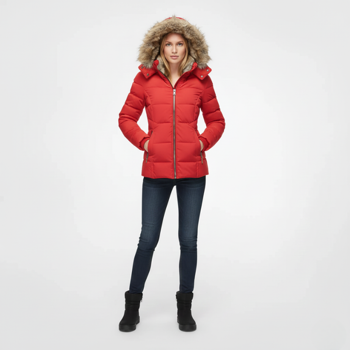 Person wearing a red puffer jacket with fur hood on a white background