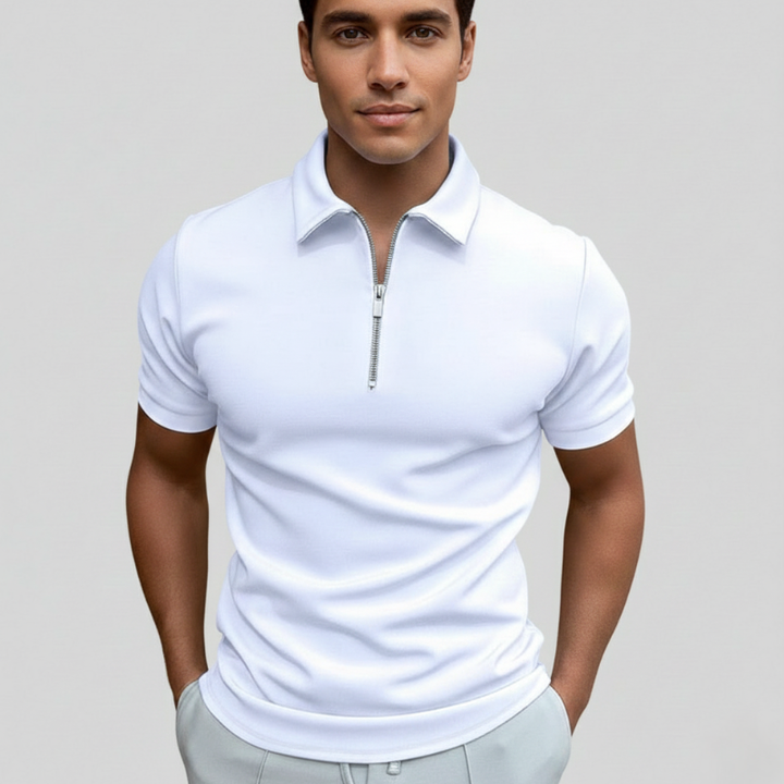 Close-up of a white polo shirt showing smooth fabric texture, stitching, and minimal collar design.