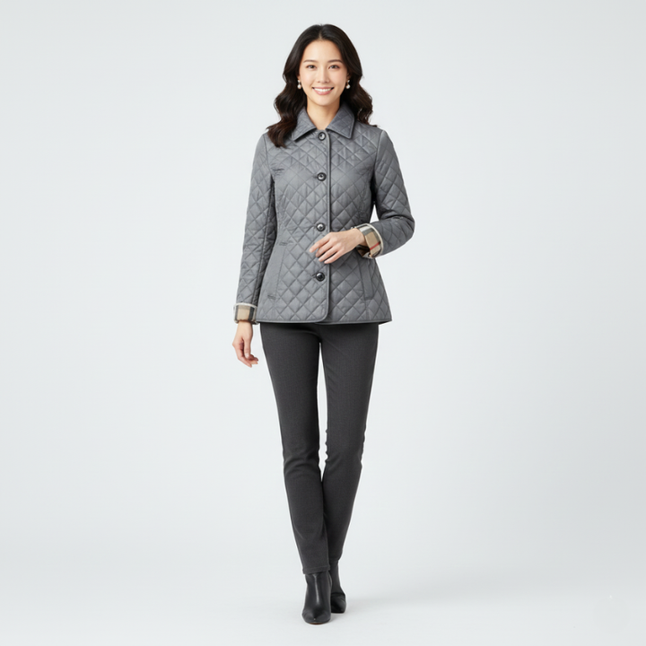 Model wearing a gray quilted jacket styled with slim-fit pants against a neutral background.