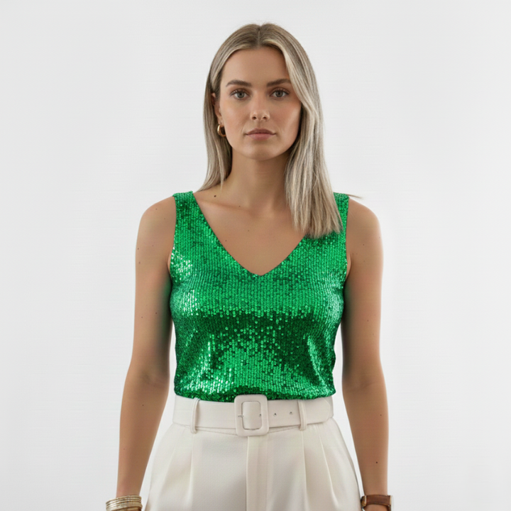 Female model in a green sequin V-neck tank top styled for festive and night-out outfits.