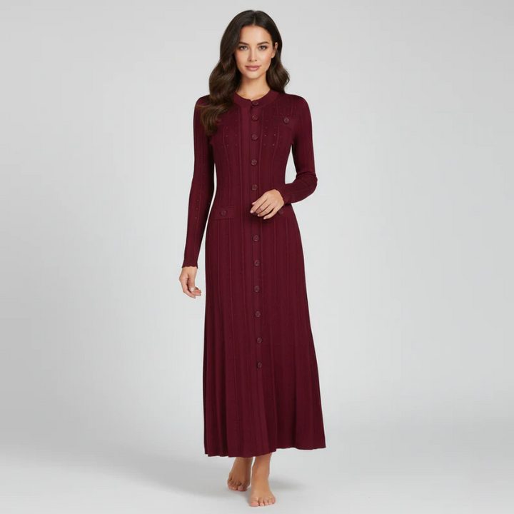 Woman wearing a burgundy long-sleeve dress on a light gray background