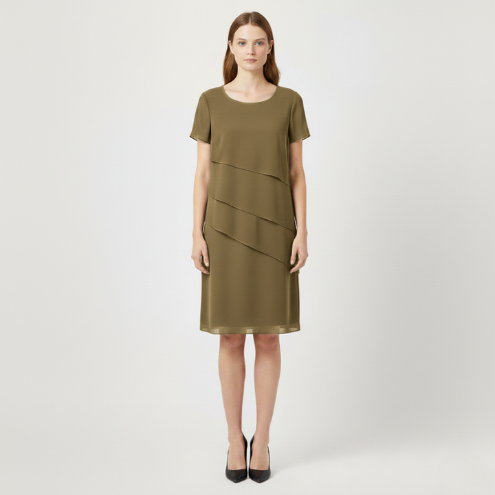 Woman wearing a kaki dress on a white background